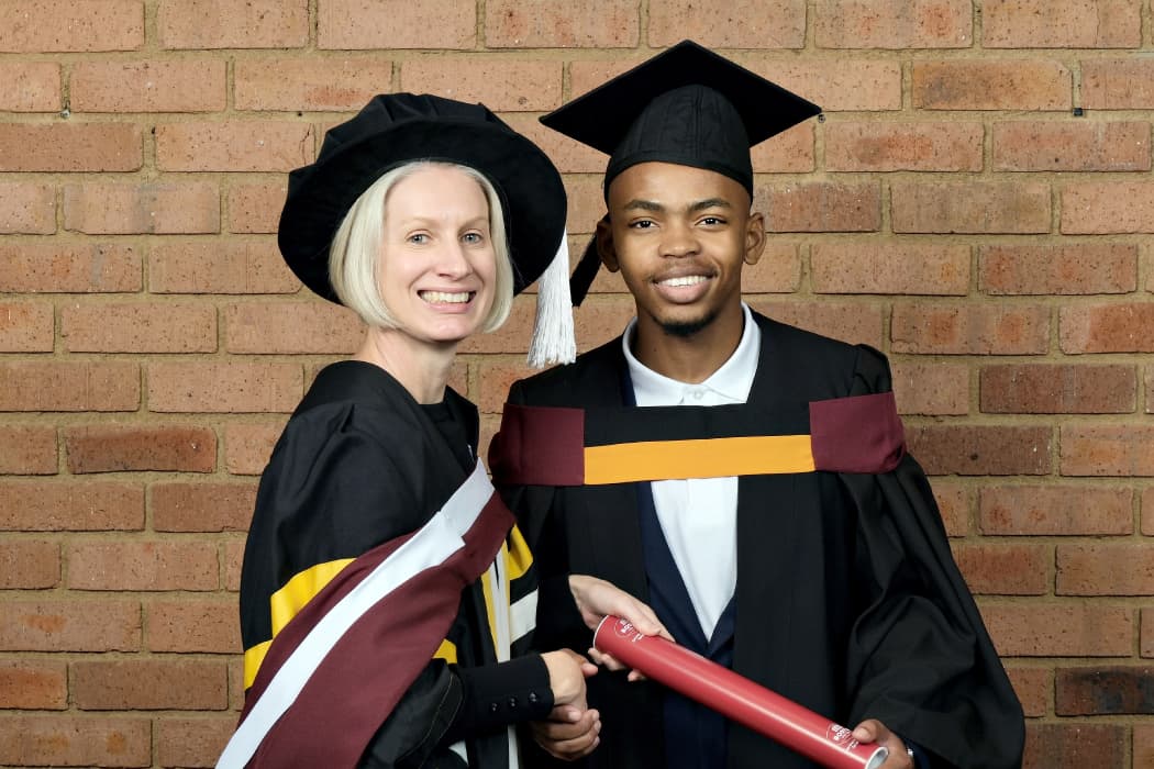 Avuyile Mthembu with a Boston City Campus faculty member